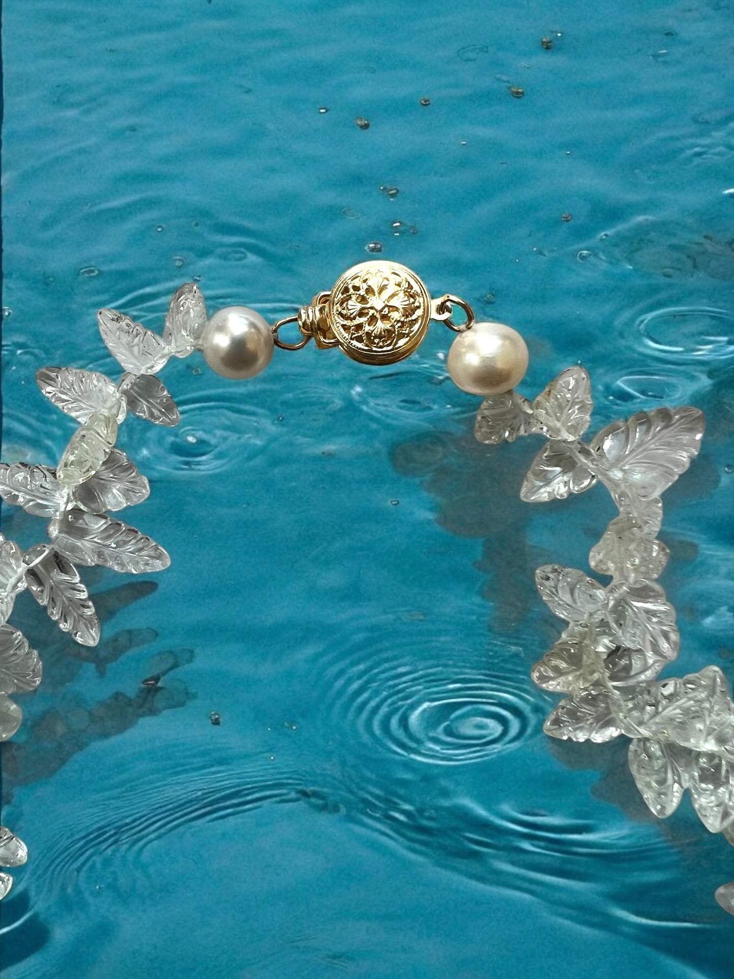 Carved Aquamarine leaf necklace with 14KY gold filigree clasp