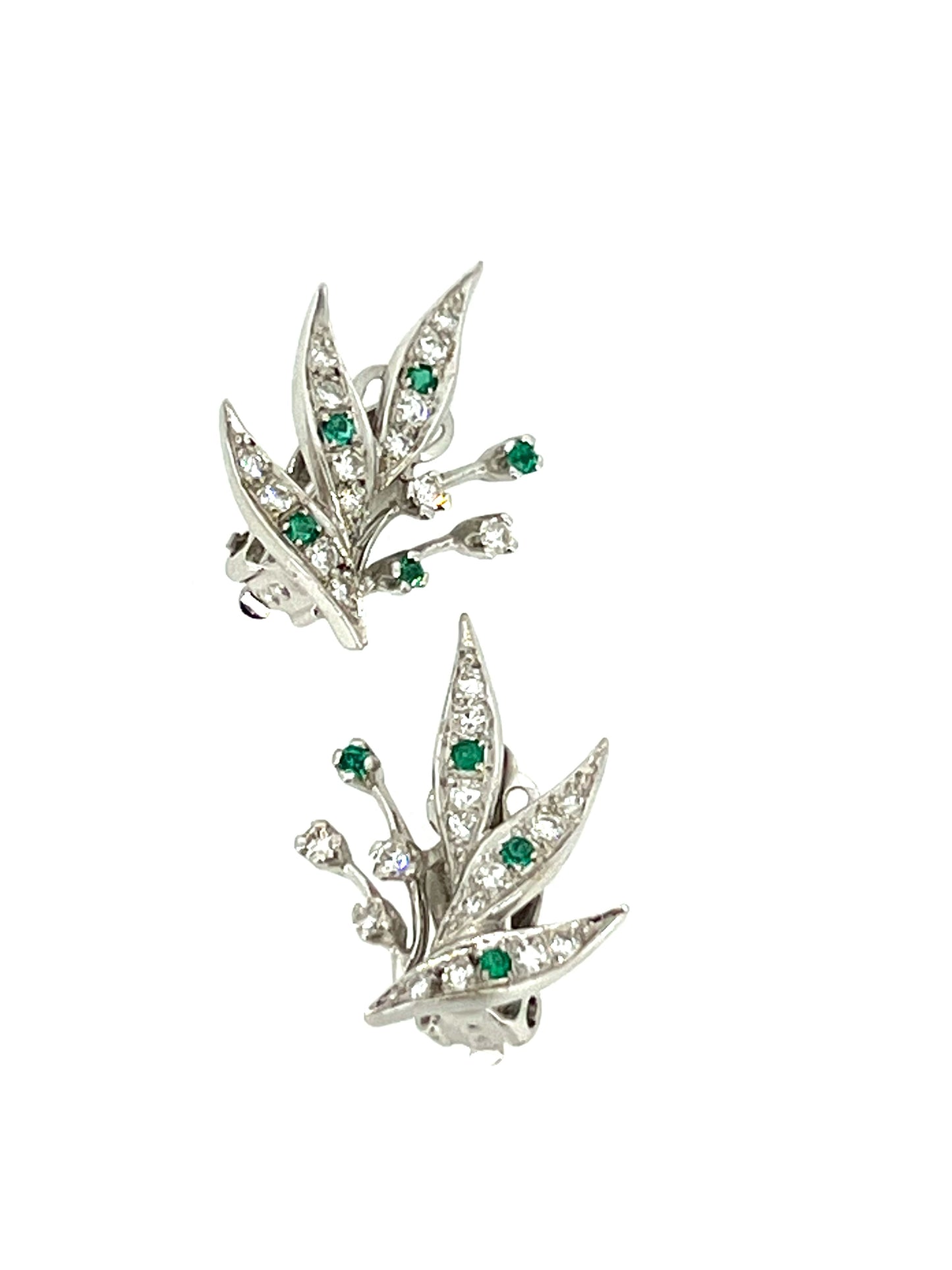 Modern 14K white gold diamond and emerald clip earrings in a botanical style