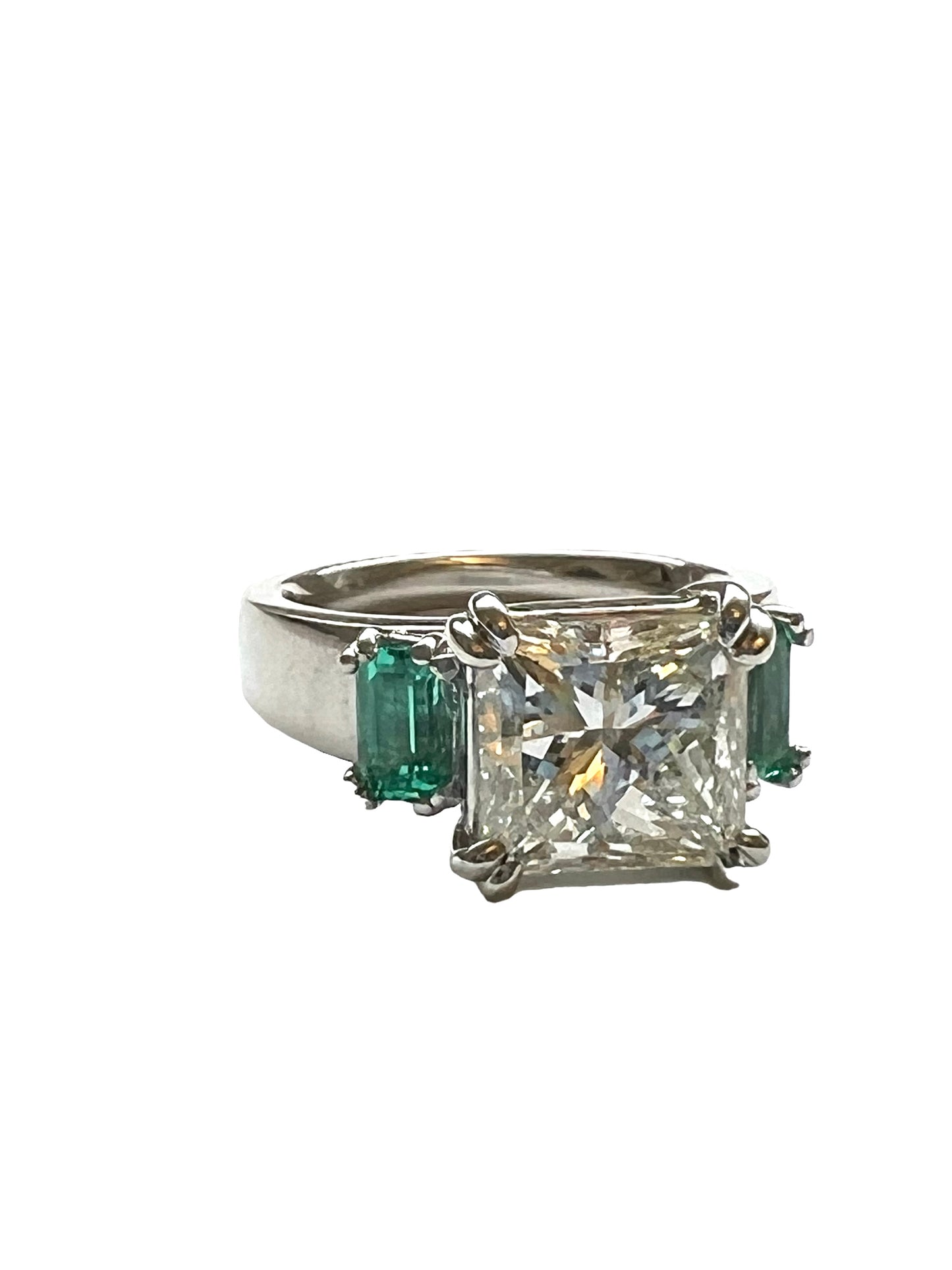 Princess Cut Diamond and Emerald ring in Platinum