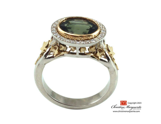 'My Summer Garden' with an oval Green Sapphire, accent natural diamonds, 18 Karat white and yellow gold