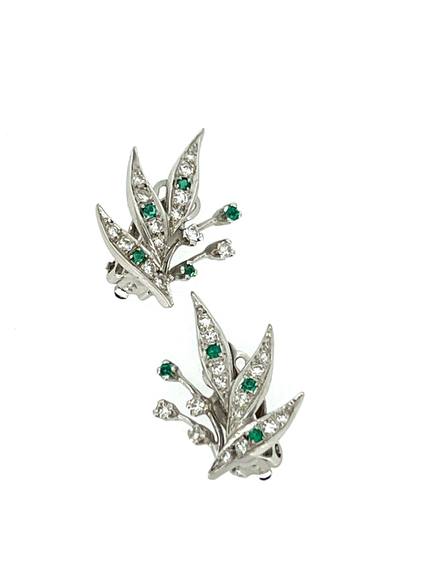 Modern 14K white gold diamond and emerald clip earrings in a botanical style